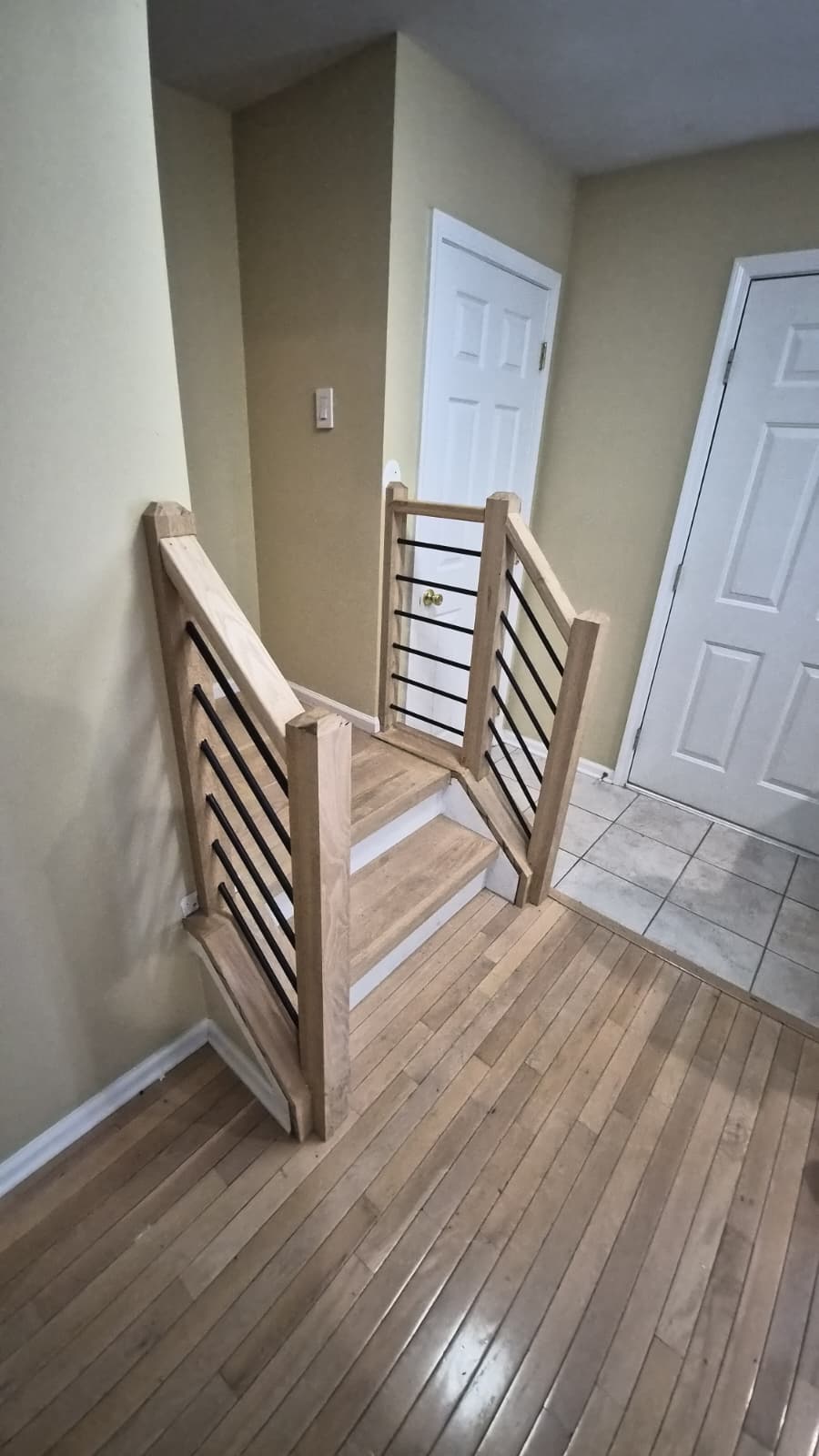 Wood staircase with new posts and handrails